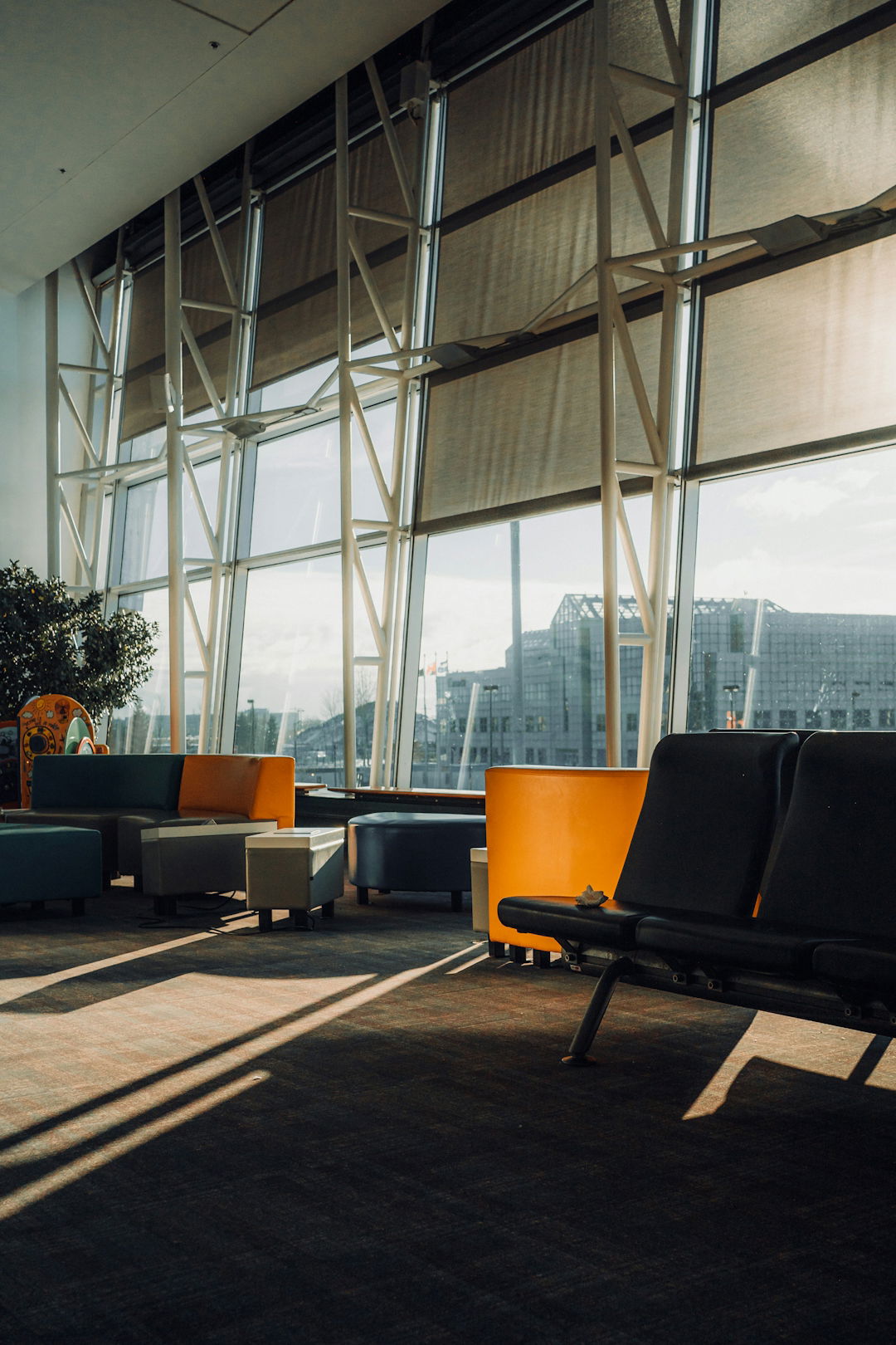modern-waiting-area-with-large-windows-and-seating-.jpg Modern waiting area with large windows and seating.